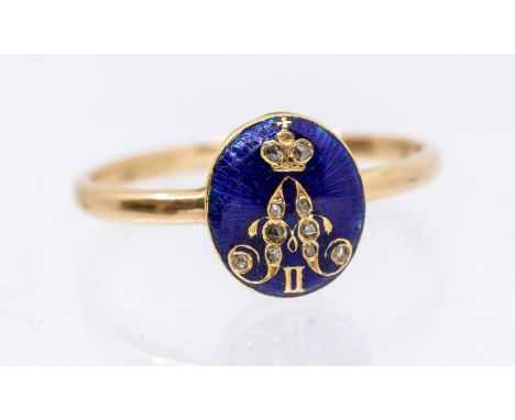 A gold, enamel and diamond ring, the oval blue enamel inlaid with a gold monogram for Alexander II, set with rose cut diamond