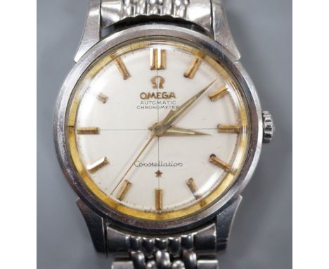 A gentleman's early 1960's stainless steel Omega Constellation automatic chronometer wrist watch, on steel Omega bracelet, mo