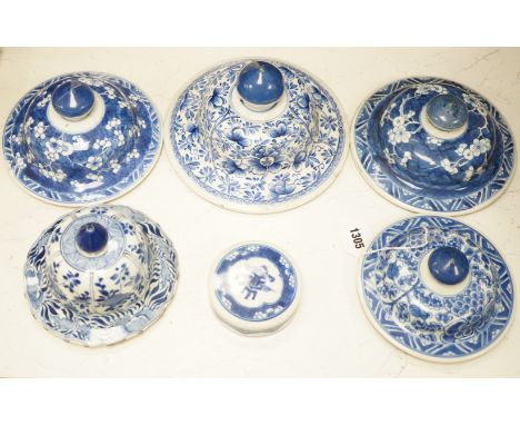 Six Chinese Kangxi blue and white vases and jar covers, largest 21.5cm diameter.Provenance - D.C.Monk &amp; Son, former deale