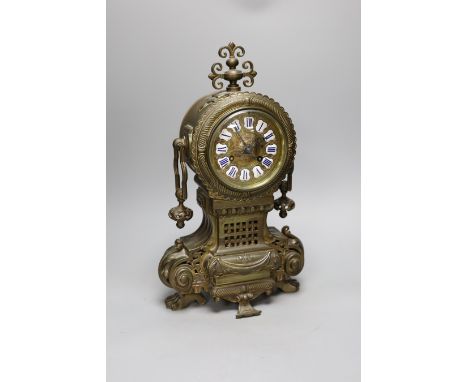 A late 19th century French brass cased mantel clock,41 cms high,