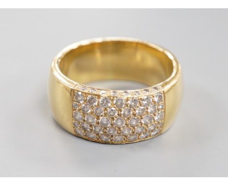 A modern yellow metal (tests as 18ct) and part pave set diamond ring, size R/S gross weight 13.4 grams.