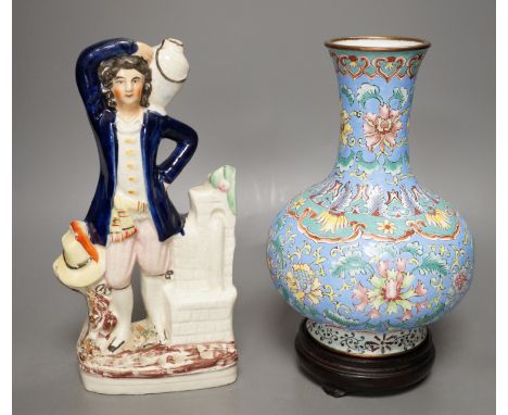 A Chinese canton enamel vase, wood stand, 23.5cm tall