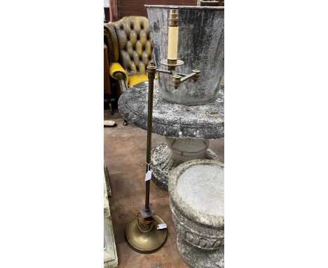 A brass adjustable standard lamp