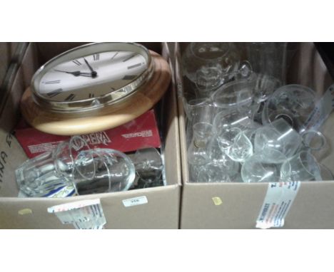 Two boxes containing various drinking glasses; a pine wall clock and various sundries