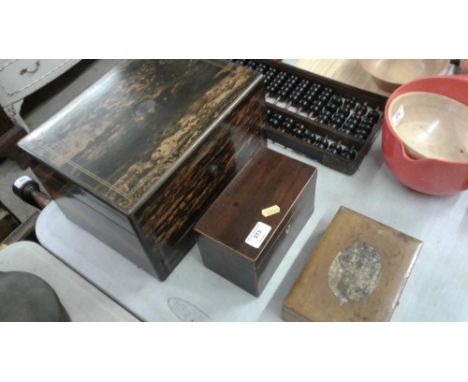 A Victorian Coromandel box; a 19th Century mahogany converted tea caddy and a Mauchline ware box containing nutcrackers etc.