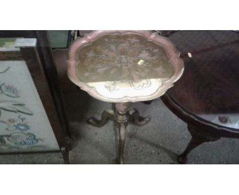 A gilt decorated wine table