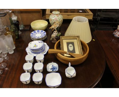 A quantity of floral decorated teaware; two owl ornaments; a turned wooden salad bowl with a pair of servers; a floral decora