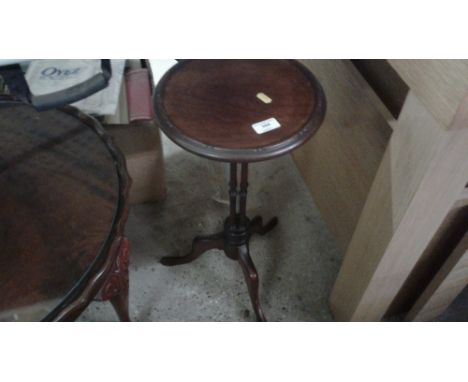 A small mahogany wine table