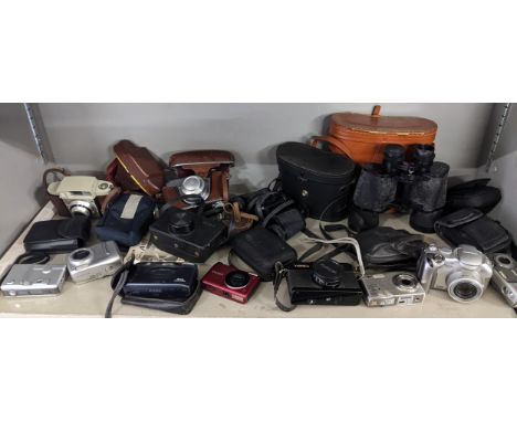 A mixed lot of cameras to include Olympus, Kodak and others, together with cased binoculars Location:If there is no condition