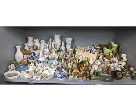 A quantity of ceramic ornaments to include Wade animals and dishes, Sylvac and Hornsea elf and deer log vases, Aynsley and We