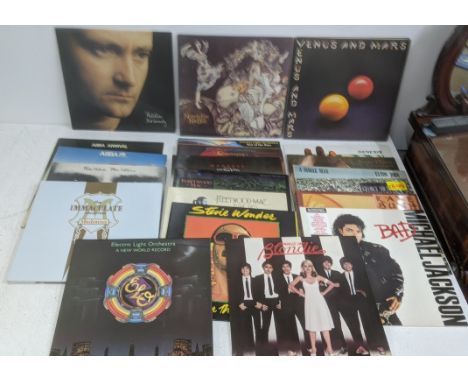 A collection of 1970s and 1980s rock and pop LPs to include Michael Jackson  Bad, Fleetwood Mac Rumours, Madness Rise & Fall,