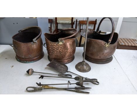 A collection of fire related metalware to include three coal scuttles, fire irons and a fire screen Location:If there is no c