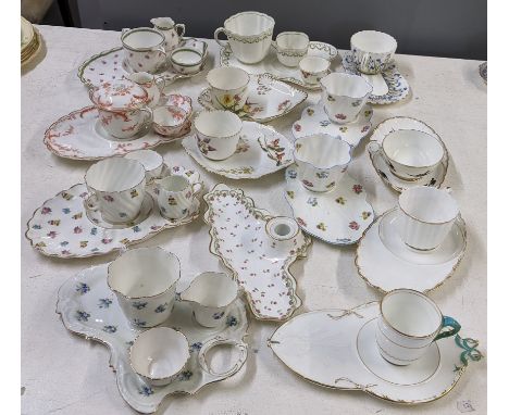 A selection of 19th century and later porcelain teacups and saucers and snake sets to include Spode, Shelley, Crescent and ot