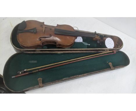 A mid 19th century violin, the body measuring 38.5cm long, labelled on the inside 'Nachahmug Vo Maggini Fecit Anno, with a ca