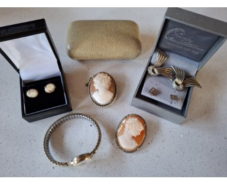 A small group of jewellery to include 2 cameo brooches and 3 pairs of earrings, one yellow metal pair having 9ct gold earring