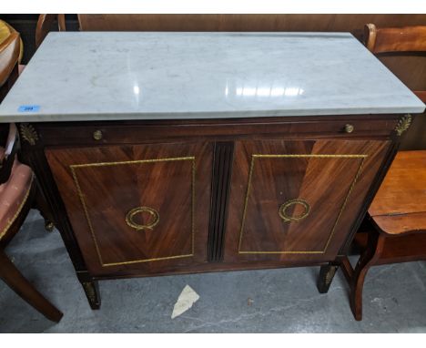 A French style mahogany drinks cabinet with marble top, a simultaneous opening, mirrored slide, and a pair of doors with mirr