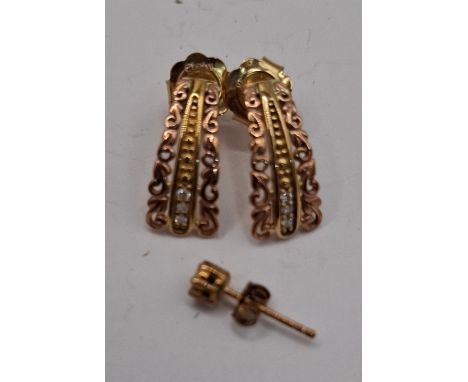 A pair of Clogau 9ct gold and rose gold earrings with 3 inset white stones to each earring having 9ct gold earring backs and 