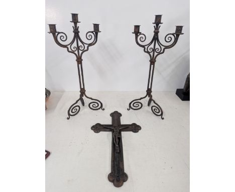 A cast iron wall hanging crucifix, 40cm high together with a pair of cast iron candelabra, 48cm highLocation:If there is no c