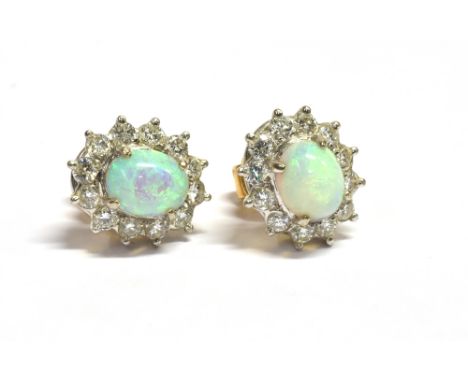 OPAL &amp; DIAMOND CLUSTER STUD EARRINGS 11.2 X 9.5mm oval claw set clusters, with central white opal oval cabochons, estimat