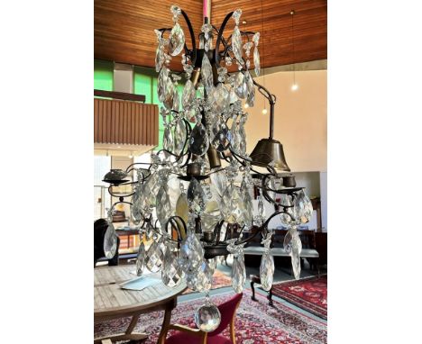 A METAL AND CUT GLASS CEILING LIGHT  fitted with five electric lights and six candle sconces, approx 51cm diameter 65cm high