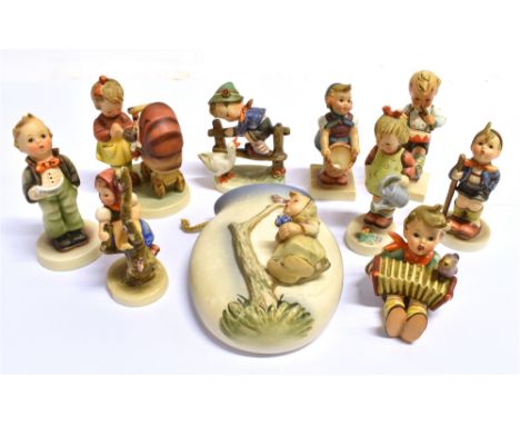 A GROUP OF NINE HUMMEL/GOEBEL FIGURES AND A WALL POCKET:  'Barnyard Hero', 'Doll Mother', 'Little Gardener', 'Apple Tree Girl