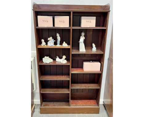 A MAHOGANY OPEN BOOKCASE  with three quarter gallery above two bays of five adjustable shelves, on plinth base 101cm wide 23c