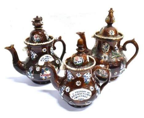 THREE MEASHAM BARGEWARE TEAPOTS  each typically decorated, the largest 36cm high Condition Report : restoration throughout:  