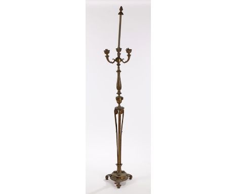 Regency style gilt metal standard lamp, with a pineapple finial above a reeded and urn column having three curved sconces abo