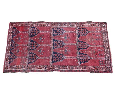 Persian rug, with four panels with lamp and foliate design, 262cm x 136cm