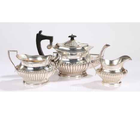 Edward VII silver three piece tea service, Birmingham 1902, maker S Glass, consisting of teapot with ebony angular handle and