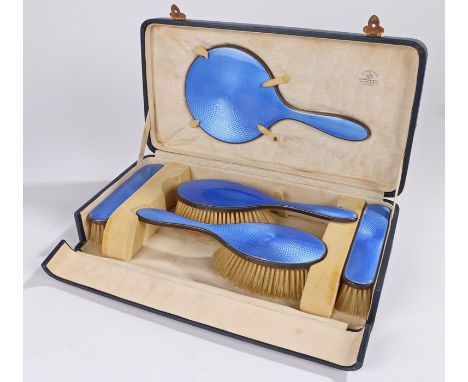 George V silver and enamel vanity set, Birmingham 1927, maker Mappin &amp; Webb, with blue enamel engine turned backs, consis