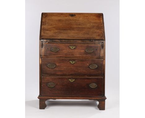 George III mahogany bureau, of narrow and tall proportions, the rectangular top above a slopping fall containing pigeon holes