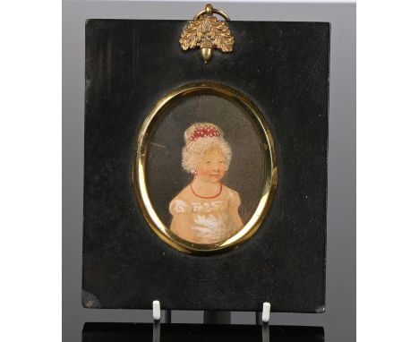 19th Century portrait miniature depicting a young girl wearing a lace edged bonnet, coral bead necklace and white dress, hous