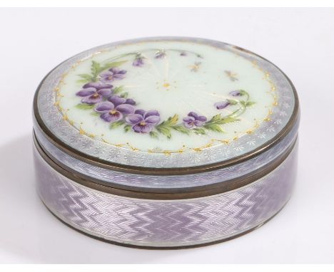 Continental silver and enamel box and cover, of cylindrical form, the purple, gilt and white enamel lid with foliate and drag