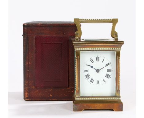 Early 20th Century gilt brass French carriage clock, the five glass case with a white enamel dial and Roman hours, lever plat