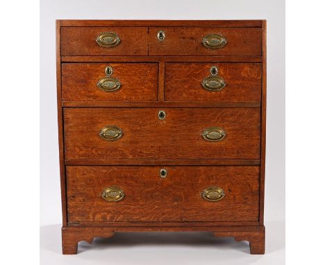 George III oak and mahogany cross banded chest of drawers, the rectangular top above a long drawer, two short and two long dr