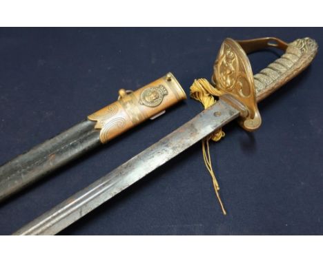 British Royal Navy Officers Sword with 30 1/2inch double fullered blade with engraved and etched detail (pitted), with half b