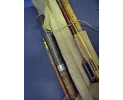 Four various assorted vintage wood and bamboo salmon rods 
