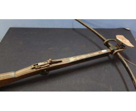 19th C stone bow, wood and steel construction with 28 inch cross piece and wrought metal wall hanging bracket 