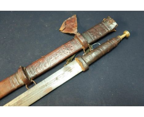 African Tuareg Sword with 31 inch blade, leather grip, brass pommel and leather scabbard with swollen point 