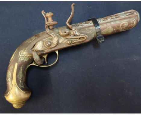 Turkish style flintlock pistol with brass mounts, white metal inlay to the 5 inch octagonal barrel and a wrought metal wall h