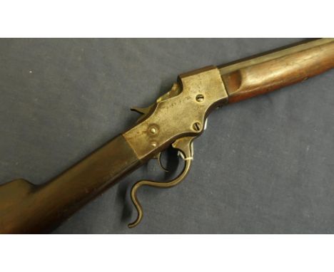 J Stevens A &amp; T Co under lever .22 carbine rifle with 22 inch first stage octagonal barrel with rear ladder sights, screw