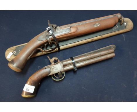 Percussion cap over &amp; under belt pistol with wall bracket and a percussion cap holster pistol by Conway with later added 