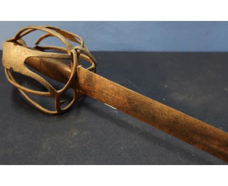 17th C basket hilted sword with 30 1/2 inch double edge blade with broad central fuller, with wire bound ribbed grip, pierced