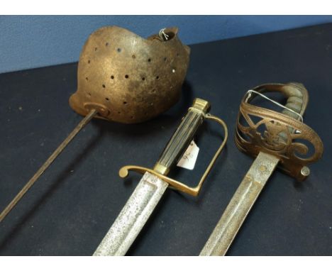 Group collection of three swords including a 18th C Hanger with ribbed grip and brass knuckle bow, a 19th C Fencing Foil and 