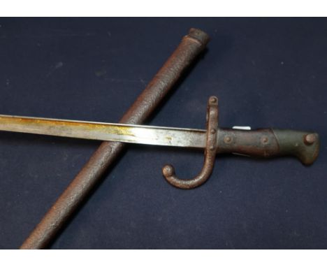 French 1878 bayonet with inscription to the back strap, 20 1/2 inch blade and complete with steel scabbard 