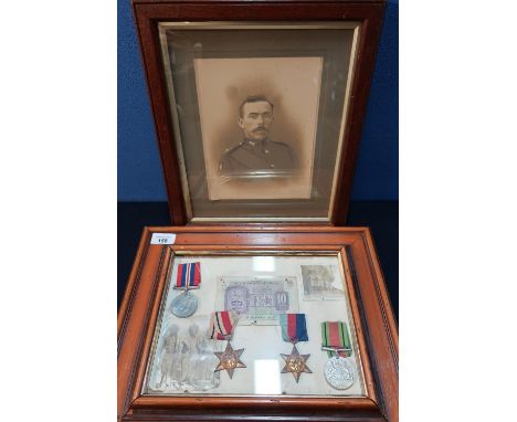 Framed and mounted display of a group of WWII medals comprising of 1939-1945 Star, Africa Star, War &amp; Defence Medals with