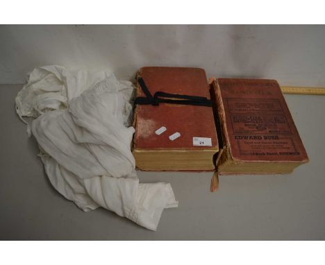 Two volumes of Kelly's Directory 1892 and 1937 together with two vintage Christening gowns