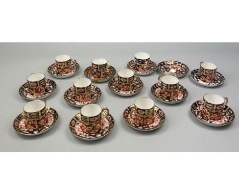 A ROYAL CROWN DERBY 2451 COFFEE SET, Consisting of eleven coffee cups and saucers, along with one spare saucer. Some damages.