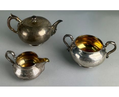 A SILVER AND GILT TEA SET BY ROBERT GARRARD II GIFTED FROM THE ATHENEUM CLUB IN PALL MALL TO THE BUTLER AND STEWARD MR JOHN B